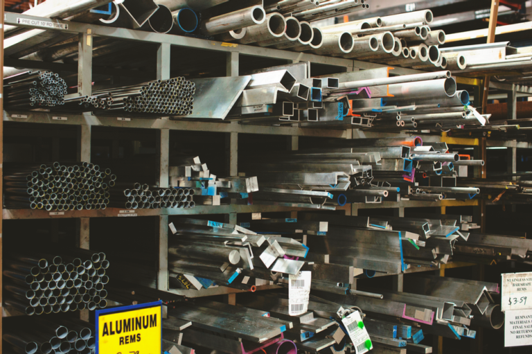 A rack of different types of aluminum tubing