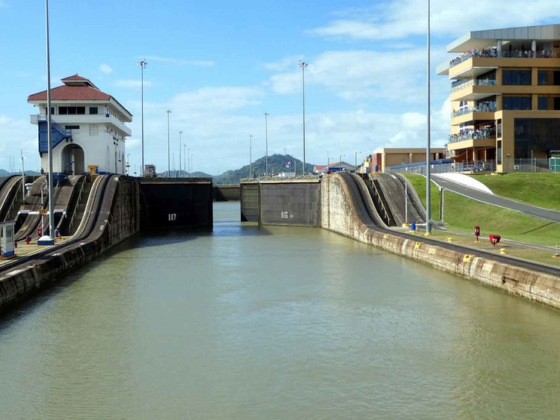 View from on a canal looking at a lock entrance opening