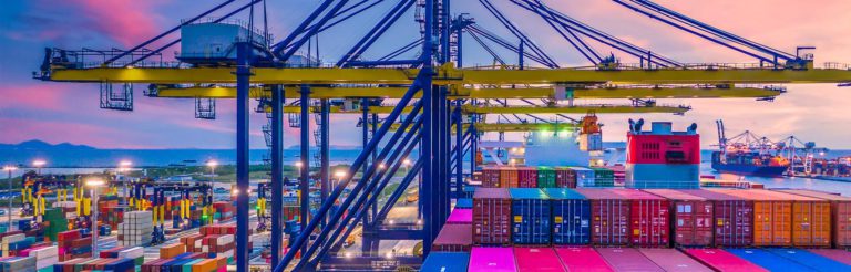 Container ship in deep sea port at night