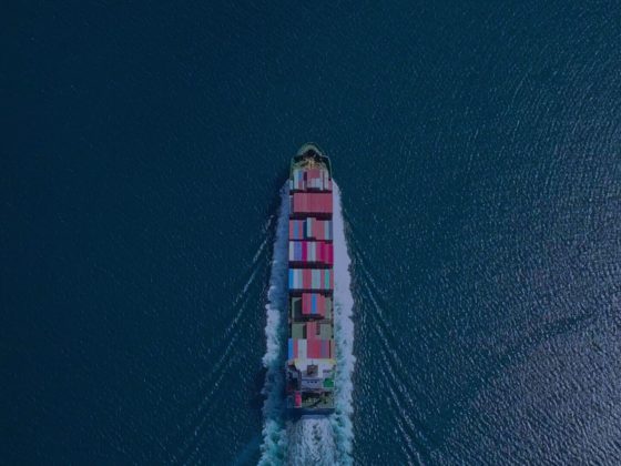 Aerial view of a loaded container ship in the open ocean